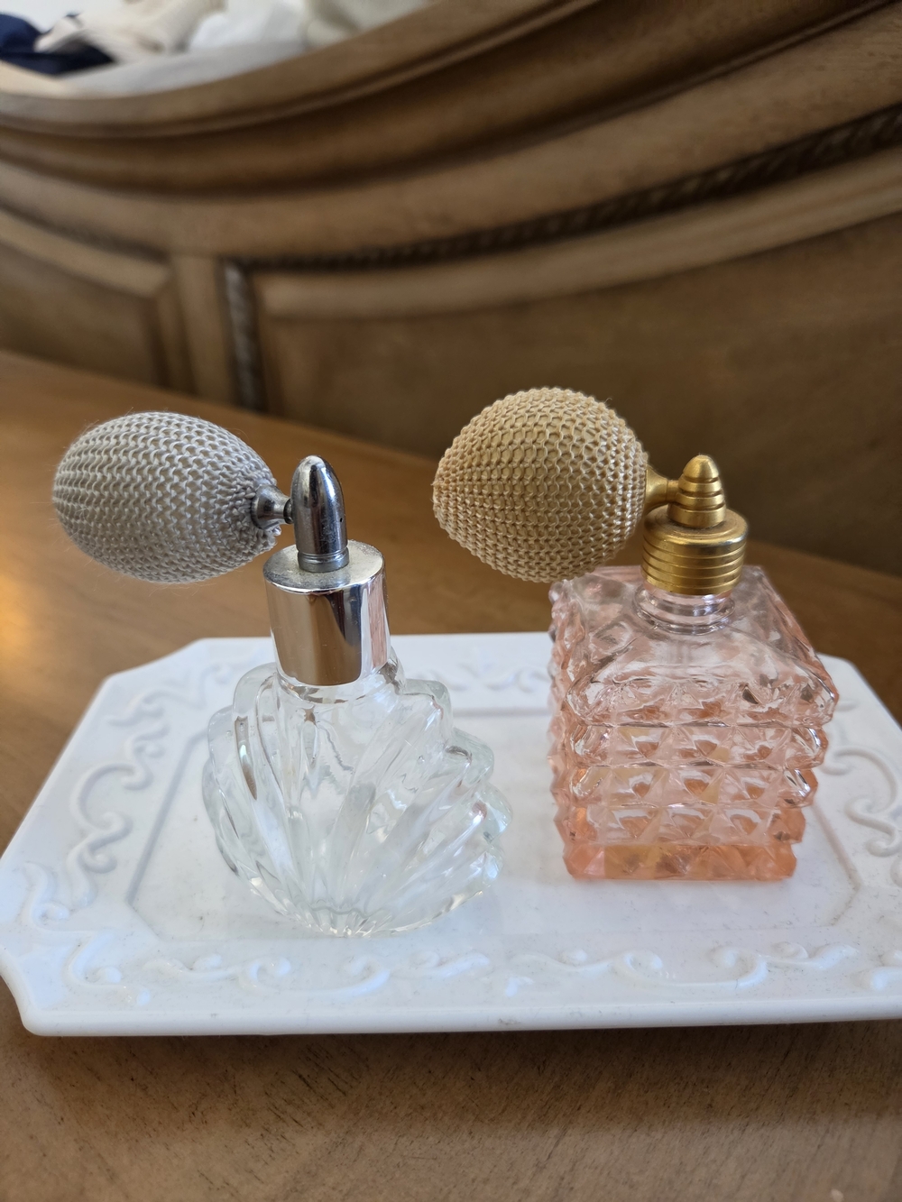 Set of Two Atomizer Perfume Bottles - Clear & Pink With White Ceramic Tray.
